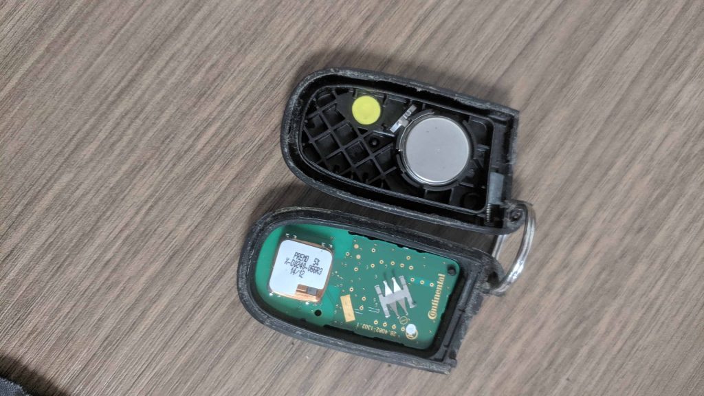 Battery in the key fob is exposed.