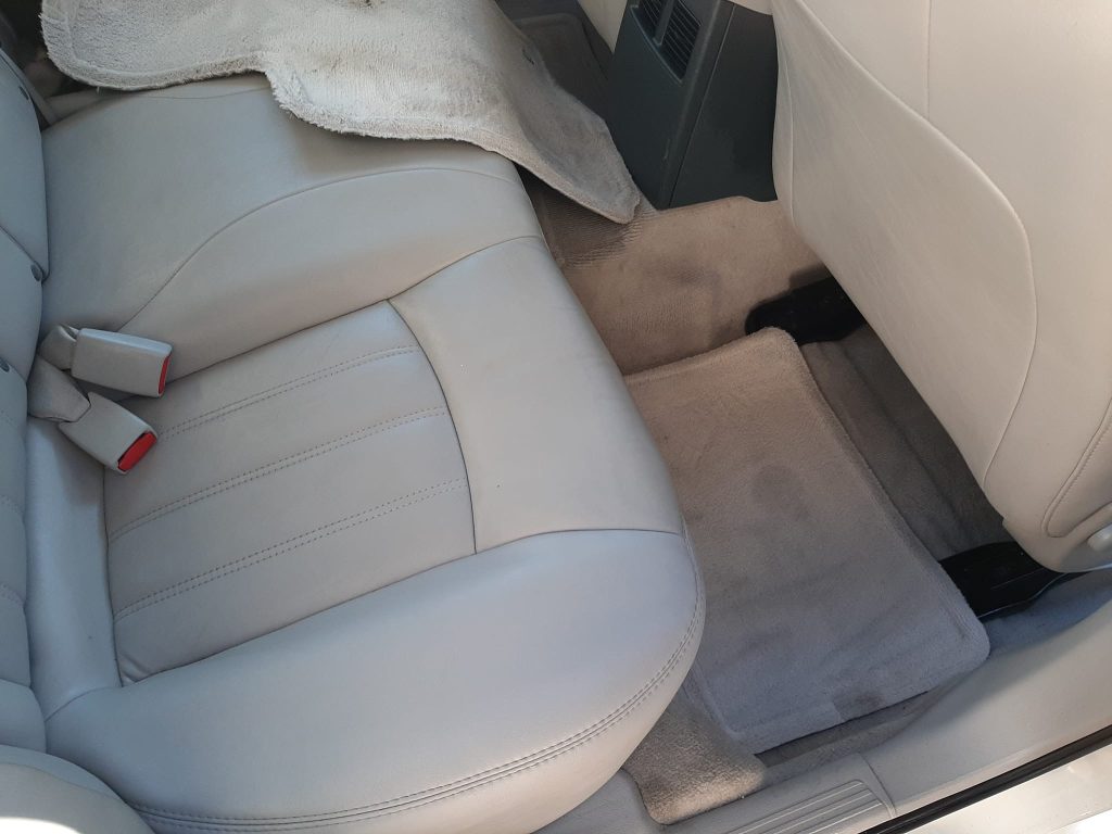 Back seat and carpet of after detail cleaning services.