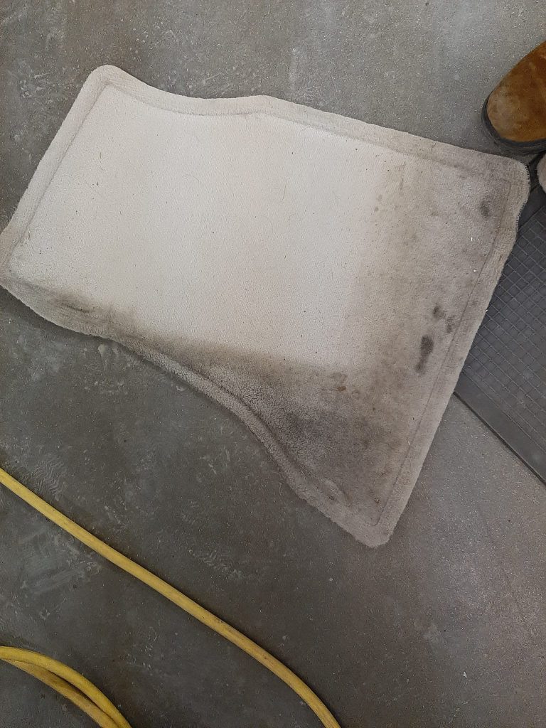A rug during vehicle detail services.